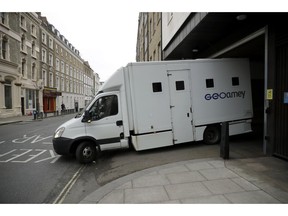 A prison van carrying unknown occupants leaves Westminster Magistrates Court in London, shortly after fugitive Indian diamond tycoon Nirav Modi was denied bail in a hearing, Wednesday, March 20, 2019. Modi, who is wanted over his alleged involvement in a $2 billion banking fraud, has been arrested in London at the request of Indian authorities.