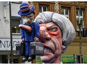 A carnival float depicts British Prime Minister Theresa May and the Brexit prior to the traditional carnival parade in Duesseldorf, Germany, on Monday, March 4, 2019. The foolish street spectacles in the carnival centers of Duesseldorf, Mainz and Cologne, watched by hundreds of thousands of people, are the highlights in Germany's carnival season on Rosemonday.