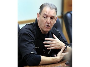 In this Feb. 20, 2019 photo, County Coroner Nick Pappas talks with a reporter at city hall in Waynesville, Mo. Posting press releases to official Facebook pages isn't quite the same. Pappas said readers are more suspicious of news releases than they would be of a fully reported news story.