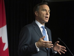 Minister of Finance Bill Morneau holds a news conference at a lockup session with reporters before the release of the federal budget in the House of Commons on Parliament Hill in Ottawa on Tuesday, March 19, 2019.