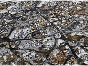 FILE - This Feb. 13, 2017 aerial photo shows the Oceti Sakowin camp, where people have gathered to protest the Dakota Access pipeline on federal land in Cannon Ball, N.D. South Dakota Gov. Kristi Noem says she's proposing legislation ahead of the Keystone XL oil pipeline's construction that would create a legal avenue to pursue out-of-state money that funds protests aimed at slowing construction. Noem's bills come after opponents of the Dakota Access oil pipeline staged large protests that resulted in 761 arrests in southern North Dakota over a six-month span beginning in late 2016. The state spent tens of millions of dollars policing the protests.