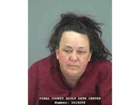 CORRECTS LAST NAME FROM HACKNEY TO HOBSON This booking photo provided by Pinal County Sheriff's Office shows Machelle Hobson. Authorities say, Tuesday, March 19, 2019,  Hobson is accused of abusing seven adopted children, including using pepper spray on them and locking them in a closet.  Hobson was booked into the Pinal County Jail on suspicion of two counts of molestation of a child, seven counts of child abuse and five counts each of unlawful imprisonment and child neglect.  (Pinal County Sheriff's Office via AP)