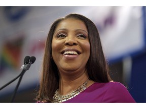FILE - In this Jan. 6, 2019 file photo, Attorney General of New York, Letitia James, smiles during an inauguration ceremony in New York. James has opened a civil investigation into President Donald Trump's business dealings, taking action after his former lawyer told Congress he exaggerated his wealth to obtain loans. A person familiar with the inquiry said James issued subpoenas Monday, March 11, to Deutsche Bank and Investors Bank seeking records related to four Trump real estate projects and his failed 2014 bid to buy the NFL's Buffalo Bills.