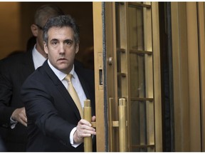 FILE - In this Aug. 21, 2018, file photo, Michael Cohen leaves Federal court, in New York. Newly released documents show the FBI was investigating President Donald Trump's former personal attorney and fixer for nearly a year before agents raided his home and office. A search warrant released Tuesday, March 19, 2019 shows the federal inquiry into Cohen had been going on since July 2017,  far longer than had previously been known.