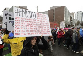 FILE - In this Saturday, Jan. 20, 2018 file photo, a marcher carries a sign with the Twitter hashtag #MeToo used by people speaking out against sexual harassment as she takes part in a Women's March in Seattle, on the anniversary of President Donald Trump's inauguration. A group of prominent U.S. foundations is launching a new fund aimed at combating sexual violence and harassment in the workplace. Organizers tell The Associated Press the fund was launched Thursday, March 14, 2019, and plans to direct most of its grants to programs led by and benefiting low-income workers, migrants and women of color. The 11 partners so far include the Ford Foundation, the Open Society Foundations, the Conrad Hilton Foundation and the NoVo Foundation.