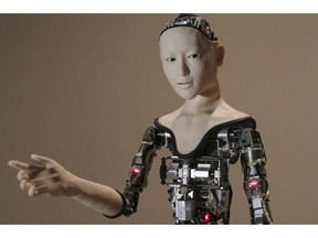 FILE - This Monday, Aug. 1, 2016 file photo shows the humanoid robot "Alter" on display at the National Museum of Emerging Science and Innovation in Tokyo. Understanding humor may be one of the last things that separates humans from ever smarter machines, computer scientists and linguists say.