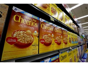 FILE- In this Aug. 8, 2018, file photo boxes of General Mills Honey Nut Cheerios cereal sit on display in a market in Pittsburgh. General Mills Inc. reports financial results Wednesday, March 20, 2019.