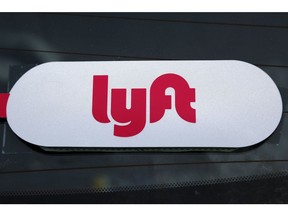 FILE - This Jan. 31, 2018 file photo shows a Lyft logo on a Lyft driver's car in Pittsburgh. Lyft set the price for its stock at $72 per share late Thursday, March 28, 2019, setting the stage for the ride-hailing pioneer's hotly anticipated stock market debut.