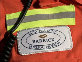 FILE - In this Feb. 14, 2006 file photo, a close-up of the chest patch of a worker at Barrick's Ruby Hill Mine, outside Eureka, Nev., is shown. Barrick Gold is dropping its takeover bid for Newmont Mining, as the gold companies instead form a joint venture to combine their Nevada mining operations. Last month Barrick Gold Corp. offered to acquire Newmont Mining Corp. for about $18 billion in stock. The joint venture will include the companies' assets and reserves in Nevada.