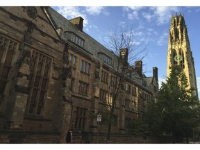 FILE - This Sept. 9, 2016 photo shows Harkness Tower on the campus of Yale University in New Haven, Conn. Dozens of people were charged Tuesday, March 12, 2019, in a scheme in which wealthy parents allegedly bribed college coaches and other insiders to get their children into some of the nation's most elite schools. The coaches worked at such schools as Yale, Wake Forest, Stanford, Georgetown, the University of Texas, the University of Southern California and the University of California, Los Angeles. A former Yale soccer coach pleaded guilty and helped build the case against others.