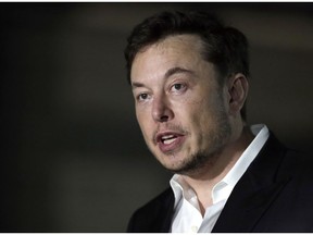 FILE - In this June 14, 2018, file photo, Tesla CEO Elon Musk speaks at a news conference in Chicago. Attorneys tell a federal judge that Tesla CEO Elon Musk shouldn't be found in contempt because he didn't violate a securities fraud settlement. The attorneys wrote in documents filed Monday night, March 11, 2019, that a Feb. 19 tweet by Musk merely restated prior disclosures on electric car production volumes.