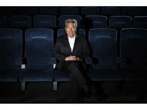 FILE - In this Feb. 6, 2013, file photo, Kevin Tsujihara, poses for photos in a screening room at the Warner Bros. Studios in Burbank, Calif. WarnerMedia is investigating claims that Warner Bros. chairman and CEO Tsujihara promised acting roles in exchange for sex as detailed in The Hollywood Reporter, Wednesday, March 6, 2019.