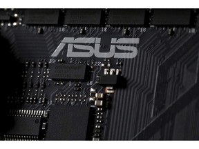 This Feb 23, 2019, photo shows the inside of a computer with the ASUS logo in Jersey City, N.J. Security researchers say hackers infected tens of thousands of computers from the Taiwanese vendor ASUS with malicious software for months last year through the company's online automatic update service. Kaspersky Labs said Monday, March 25, that the exploit likely affected more than 1 million computers from the world's No. 5 computer company, though it was designed to surgically install a backdoor in a much smaller number of PCs.