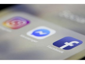 Facebook, Messenger and Instagram apps are are displayed on an iPhone on Wednesday, March 13, 2019, in New York. Facebook says it is aware of outages on its platforms including Facebook, Messenger and Instagram and is working to resolve the issue.