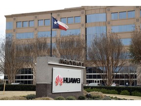 FILE - This March 7, 2019 file photo shows the Huawei Technologies Ltd. business location in Plano, Texas. The No. 2 smartphone maker in the world will be arraigned at federal court in New York on Thursday, March 14. Prosecutors have accused Huawei of using a Hong Kong front company to trade with Iran in violation of U.S. sanctions.