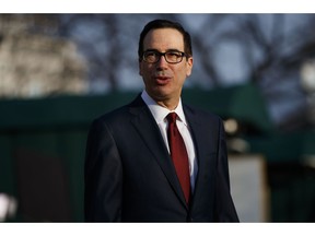 File-This Feb. 6, 2019, file photo shows Treasury Secretary Steve Mnuchin speaking with reporters outside the White House, in Washington. Mnuchin has informed Congress that he will stop making payments into two government retirement funds now that the debt limit has gone back into effect. In a letter Monday, March 4, 2019, to congressional leaders, Mnuchin said that he would stop making investments into a civil service retirement fund and a postal service retirement fund.