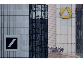 Headquarters of Deutsche Bank, left, and Commerzbank are seen in Frankfurt, Germany, Monday, March 18, 2019. Deutsche Bank and Commerzbank begin talks on a possible merger.
