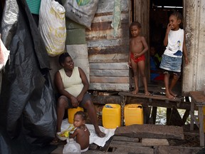 Residents are seen in the village of Hanuabada in Port Moresby, Papua New Guinea, where just 13 per cent of the country’s population has access to electricity, Joe Oliver writes.