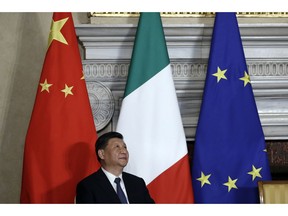 Chinese President Xi Jinping attends with Italian Premier Giuseppe Conte the signing ceremony of a memorandum of understanding at Rome's Villa Madama, Saturday, March 23, 2019. Italy signed a memorandum of understanding with China on Saturday in support of Beijing's "Belt and Road" initiative, which aims to weave a network of ports, bridges and power plants linking China with Africa, Europe and beyond.