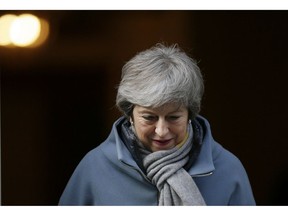 Britain's Prime Minister Theresa May leaves 10 Downing street in London, Thursday, March 14, 2019. British lawmakers faced another tumultuous day Thursday, as Parliament prepared to vote on whether to request a delay to the country's scheduled departure from the European Union and Prime Minister Theresa May struggled to shore up her shattered authority.
