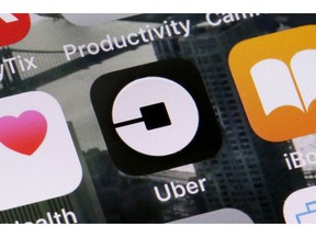 FILE - This June 12, 2018, file photo shows the Uber app on a phone in New York. Ride-hailing service Uber announced on Tuesday, March 26, 2019 it has acquired its Mideast competitor Careem for $3.1 billion, making it the largest-ever technology purchase in the region.