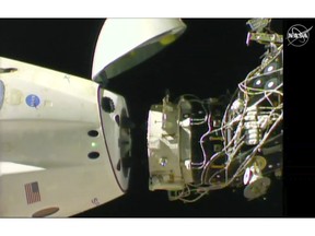 In this image taken from NASA Television, SpaceX's swanky new crew capsule undocks from the International Space Station Friday, March 8, 2019. The capsule undocked and is headed toward an old-fashioned splashdown. The Dragon capsule pulled away from the orbiting lab early Friday, a test dummy named Ripley its lone occupant. (NASA TV via AP)