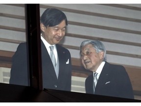 FILE - In this Dec. 23, 2018, file photo, Japan's Emperor Akihito, right, accompanied by Crown Prince Naruhito, walks away after greeting well-wishers when they appeared on the balcony of the Imperial Palace to mark the emperor's 85th birthday in Tokyo. What's in a name? Quite a lot if you're a Japanese citizen awaiting the official announcement Monday. April 1, 2019 of what the soon-to-be-installed new emperor's next era will be called. It's a proclamation that has happened only twice in nearly a century, and the new name will follow Emperor Naruhito, after his May 1 investiture, for the duration of his rule, attaching itself to much of what happens in Japan.