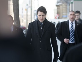 Prime Minister Justin Trudeau walks to the National Press Theatre in Ottawa to deliver remarks on the SNC Lavalin scandal on Thursday.