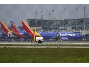 A Boeing 737 MAX 8 operated by Southwest Airlines sits at a gate at Hobby Airport after arriving Wednesday, March 13, 2019, in Houston. The flight was already in the air on its way to Houston when the emergency order ground all 737 Max 8 and Max 9 aircraft was issued on Wednesday.