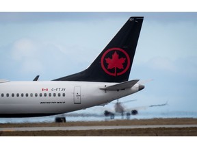 An Air Canada Boeing 737 Max 8 aircraft departing for Calgary taxis to a runway at Vancouver International Airport in Richmond, B.C., on Tuesday, March 12, 2019.