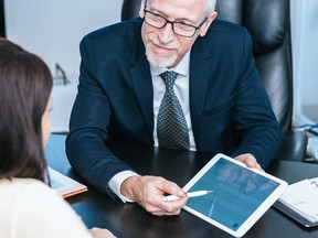 Woman meeting financial adviser in office