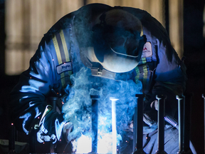A welder at work. Canada’s traditional economy posted few new jobs last month.