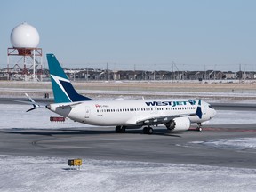 A Westjet Boeing 737 Max 8 prepares for takeoff at YYC Calgary International Airport in Calgary, Alta. on Monday, Feb. 26 2018.