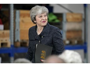 Britain's Prime Minister Theresa May gives a speech in Grimsby, Britain, Friday March 8, 2019. Battling to stave off a second defeat for the unpopular deal, May also implored the EU to help her make "one more push" to get her Brexit agreement through a skeptical British Parliament.