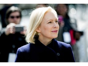 In this March 24, 2019 photo, Sen. Kirsten Gillibrand, D-N.Y., listens to actress Connie Britton speak before taking the stage to deliver a speech at the kickoff of her presidential campaign, in New York. Gillibrand has released her tax returns for 2018, showing she paid $29,170 in federal taxes on an income of $214,000.