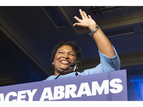 FILE - In this Nov. 6, 2018 file photo, former Georgia Democratic gubernatorial candidate Stacey Abrams speaks to supporters in Atlanta.  Abrams has gone from losing the Georgia governor's race to being a heavily recruited Democratic star. It's a dramatic rise often fueled by the promotional spending of Fair Fight Action, a nonprofit she founded to promote voting rights. They can accept unlimited sums of money, which could be a problem if she runs for office again. There is no proof of illegal activity. But donation limits could be applied retroactively to the group's spending if she runs for federal office.