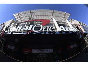 In this photograph taken with a fisheye lens, the exterior view of Capital One Arena is seen, Saturday, March 16, 2019, in Washington. As the NCAA prepares to stage its first basketball championships since the Supreme Court allowed legal sports betting in any state that wants it, the organization remains opposed to gambling on its events. But it's not denying reality, either. The NCAA had a longtime ban on bringing its championships to places where gambling on sports was legal. That was suspended last year in the wake of the Supreme Court decision. This year, three women's games will be played in Mississippi, where people have been betting on college sports since last summer, and men's games will be played in Washington at Capital One Arena, which could have a full-service onsite sportsbook by this time next year under a new law.