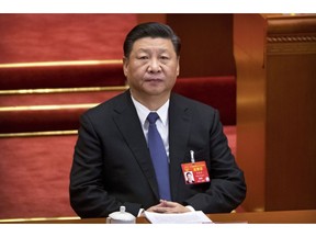 FILE - In this March 12, 2019, file photo, Chinese President Xi Jinping attends a plenary session of China's National People's Congress (NPC) at the Great Hall of the People in Beijing. The country's foreign ministry announced on Monday, March 18, 2019 that Xi will visit Italy, France and Monaco from Thursday to March 26.