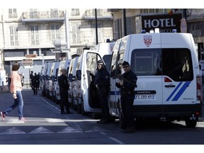 Police officers guard street during a protest in Nice, southeastern France, Saturday, March 23, 2019. The French government vowed to strengthen security as yellow vest protesters stage a 19th round of demonstrations, following last week's riots in Paris.