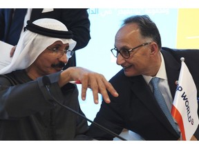 Sultan Ahmed bin Sulayem, the group chairman and CEO of Dubai-backed port operator DP World, left, speaks with DP World's Chief Financial Officer Yuvraj Narayan, in Dubai, United Arab Emirates, Thursday, March 14, 2019. Global port operator DP World said Thursday its profit rose 10 percent in 2018, overcoming worldwide tensions over trade amid a trade war between China and the U.S. and fears about Britain leaving the European Union.