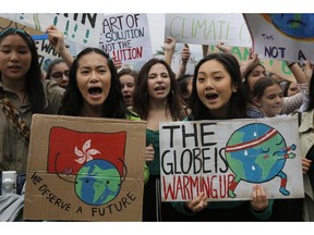 Hundreds of schoolchildren take part in a climate protest in Hong Kong, Friday, March 15, 2019. Students in more than 80 countries and territories worldwide plan to skip class Friday in protest over their governments' failure to act against global warming. The coordinated 'school strike' was inspired by 16-year-old activist Greta Thunberg, who began holding solitary demonstrations outside the Swedish parliament last year.