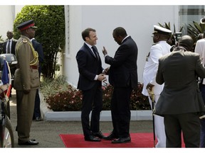 France's President Emmanuel Macron, right, meets with Kenya's President Uhuru Kenyatta on his arrival at State House in Nairobi, Kenya Wednesday, March 13, 2019. Macron is visiting Kenya Wednesday, after stops in Ethiopia and Djibouti on Tuesday, as part of his latest Africa visit aimed at shoring up military and economic ties in an increasingly strategic region.