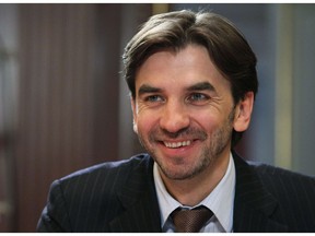 FILE - In this Wednesday, Jan. 18, 2012 file photo former Minister in charge of the "Open Government" Mikhail Abyzov, smiles in the Gorki residence outside Moscow. Russian  Investigative Committee officials said Tuesday March 26, 2019, that Abyzov, who was a member of the Russian Cabinet in 2012-2018, has been arrested on charges of fraud.