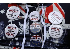 A pro-Brexit leave the European Union supporter takes part in a protest outside the Houses of Parliament in London, Wednesday, March 13, 2019. European Union officials on Wednesday criticized the U.K. Parliament for rejecting a Brexit deal for a second time as the bloc prepared for a chaotic, cliff-edge departure.