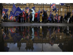 Anti-Brexit remain in the European Union supporters, take part in a protest outside the House of Parliament in London, Tuesday, March 12, 2019. Prime Minister Theresa May's mission to secure Britain's orderly exit from the European Union appeared headed for defeat Tuesday, as lawmakers ignored her entreaties to support her divorce deal and end the political chaos and economic uncertainty that Brexit has unleashed.