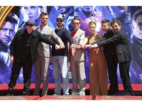 Marvel Studios President Kevin Feige, from left, poses with members of the cast of "Avengers: End Game," Chris Hemsworth, Chris Evans, Robert Downey Jr., Scarlett Johansson, Jeremy Renner and Mark Ruffalo at a hand and footprint ceremony at the TCL Chinese Theatre on Tuesday, April 23, 2019, in Los Angeles.