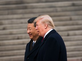 President Donald Trump and President Xi Jinping of China in Beijing, Nov. 9, 2017.  As the world turned Thursday, investment markets were clattering with the news that the China/U.S. trade war might be coming to end.