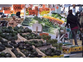 Various vegetables are on display for sale at the Jean Talon Market in Montreal on January 11, 2016. Statistics Canada says the consumer price index in March was up 1.9 per cent compared with a year ago.