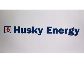 Husky Energy logo is shown at the company's annual meeting in Calgary, Alta., Friday, May 5, 2017. Husky Energy Inc. says it earned $328 million in its latest quarter, up from $248 million a year ago.