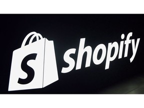 A Shopify logo is seen during an event in Toronto on Tuesday, May 8, 2018. Shopify Inc. reported a loss of US$24.2 million in its latest quarter as its revenue grew 50 per cent compared with a year ago.